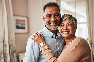 Image showing Portrait, happy and senior couple in home living room for bonding together. Face, elderly man and Indian woman in lounge to smile for quality time, hug for support and embrace for love in retirement