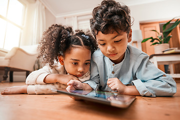 Image showing Children, tablet and home education, online development and internet games for kindergarten or home school. Young kids relax on floor with digital technology for video or app streaming subscription