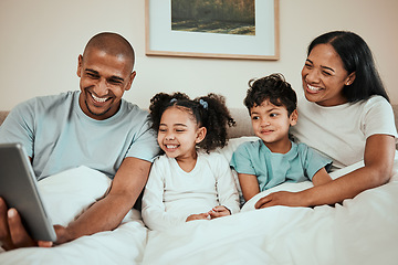 Image showing Parents watching a movie on a tablet with their kids in the bed to relax, rest and bond. Happy, smile and children streaming show or video on social media on digital technology with mother and father