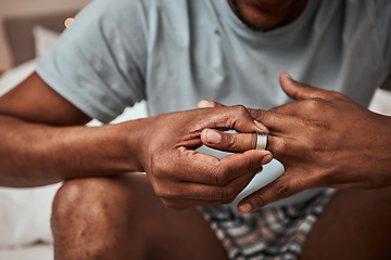 Image showing Divorce, breakup and wedding ring with hands of person in bedroom for fight, conflict and sad. Jewelry, doubt and affair with closeup of man and engagement band at home for angry, problem and loss