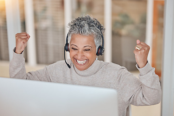 Image showing Computer, success and a senior woman in a call center for customer service, support or motivation. Contact, headset and a happy female consultant in celebration at a desk in a professional crm office