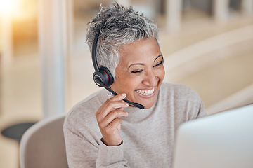 Image showing Computer, smile and a senior woman in a call center for customer service, support or assistance online. Contact, headset and a happy female consultant working at a desk in her professional crm office