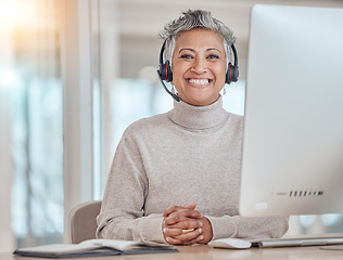 Image showing Portrait, computer and happy with a senior woman in a call center for customer service, support or assistance online. Contact, smile and an elderly consultant working at a desk in her crm office