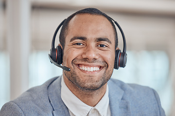 Image showing Call center, smile and face of man with headphones in office for telemarketing, support and crm. Contact us, portrait and customer service professional, sales agent and happy consultant from Brazil