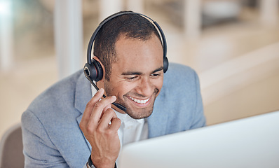 Image showing Call center, smile and man at computer for telemarketing, support and crm in office. Contact us, reading and customer service professional, sales agent or consultant at help desk for listening online