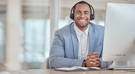 Image showing Call center, portrait and happy man at table for telemarketing, support and crm in office. Face, smile and customer service professional, sales agent consultant or worker at help desk on mockup space