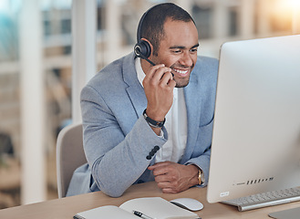 Image showing Call center, listening and happy man at computer for telemarketing, support and crm in office. Contact us, smile and customer service professional, sales agent or consultant at help desk for business