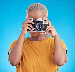 Image showing Photographer woman, retro camera and studio for journalist job, art or photoshoot by blue background. African girl, lens and tech for creativity, production or content creation for paparazzi magazine