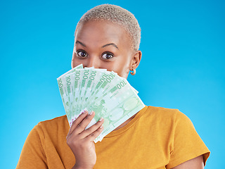 Image showing Money, winner and woman cover face on blue, studio background for winning, cash fan or financial loan. Lottery, bank and young african person with bonus, budget secret and finance profit in portrait