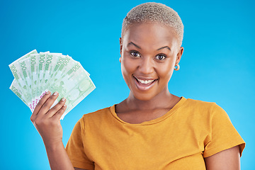Image showing Black woman, money fan and finance, portrait and happy with prize, loan and dollars isolated on blue background. Cash, cashback and lottery win with payment, financial freedom and bills in studio