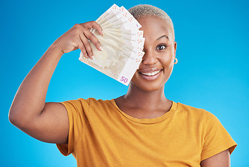 Image showing Black woman, cash fan and portrait, happy with prize and finance, loan and euros isolated on blue background. Money, cashback and lottery win with payment, financial freedom and bills with bonus