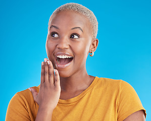 Image showing Surprise, thinking or excited black woman in studio for shocking news or deal offer on blue background. Wow reaction, omg and happy female person shocked by gossip, announcement, promotion or deal