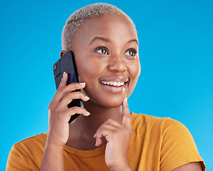 Image showing Black woman, phone call and thinking of university decision, listening to news and feedback on a blue, studio background. Happy person or student on mobile communication with ideas or future planning