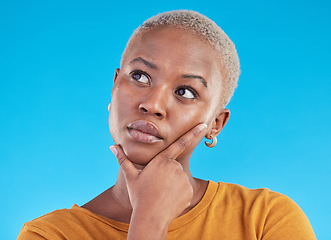 Image showing Thinking, decision and black woman with ideas, opportunity and planning on a blue studio background. Person, girl and model with problem solving, solution and question with choice and mockup space