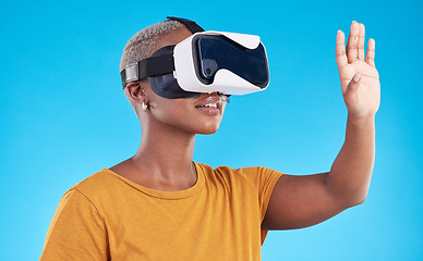 Image showing Black woman, metaverse and virtual reality with future technology and 3D isolated on blue background. User experience, VR goggles and female person, digital world and software with gaming in a studio