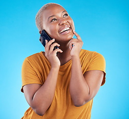 Image showing Happy woman, phone call and ideas or university decision, listening to news and feedback on a blue, studio background. African person or student on mobile communication, thinking and future planning