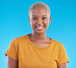 Image showing Portrait, fashion and happy black woman in studio isolated on a blue background. Face, smile and young African person, model or girl with confidence from Kenya with style, casual clothes and tshirt