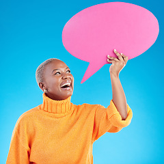 Image showing Speech bubble, contact us or black woman for social media communication with mockup space in studio. Smile, talking or happy African girl speaking of review, feedback voice or news on blue background