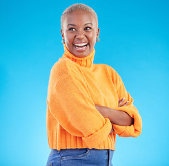 Image showing Happy, African woman and fashion with studio, blue background natural beauty or confidence in casual style or clothes. Face, smile and person with happiness in winter clothing or college student