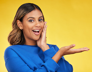 Image showing Portrait, showing and woman excited, surprise and happiness on a yellow studio background. Face, female person or model with shock, wow and omg with mockup space, emoji and smile with gesture or deal