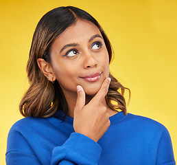 Image showing Thinking, idea and young woman in a studio with a dreaming, choice or brainstorming facial expression. Remember, thoughtful and Indian female model with planning or decision face by yellow background