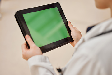 Image showing Hands, healthcare and green screen on a tablet with a doctor in the hospital for review or diagnosis. Medical, website or research with blank chromakey space on an empty display or screen in a clinic