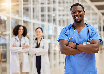 Image showing Happy black man, portrait and doctor with arms crossed for medical services, advice and consulting in busy hospital. Surgeon, male nurse and healthcare therapist for expert, trust and pride in clinic