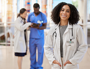 Image showing Woman, portrait and doctor smile for medical services, advice and consulting in busy hospital. Happy surgeon, female therapist and expert healthcare employee with confidence, trust or pride in clinic