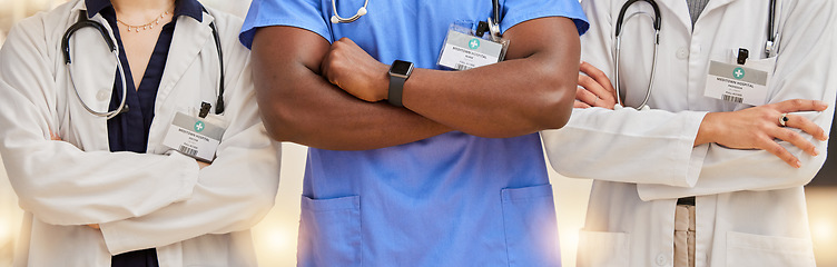 Image showing Doctors, healthcare and team with arms crossed in a hospital for teamwork and collaboration. Diversity, group and professional man and women with stethoscope and name tag for career in medicine