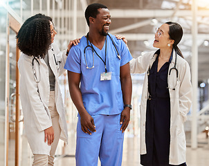 Image showing Doctors, hospital and healthcare team laughing together with teamwork, motivation and collaboration. Diversity, happy and professional man and women with support, funny joke and career in medicine
