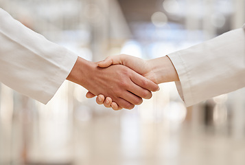 Image showing Doctors, partnership and handshake for collaboration, agreement and teamwork. Shaking hands, medical professional and people in cooperation for healthcare, wellness and thank you, welcome and success