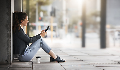 Image showing Phone, woman and coffee break in the city, street or job search, employment or network on social media, internet or online. Unemployed, worker sitting and reading news or wanted ads on cellphone