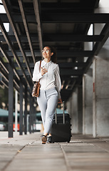 Image showing Phone, thinking and suitcase with a business woman walking in an airport parking lot outdoor in the city. Mobile, luggage and travel with a young female professional on an international trip for work