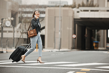 Image showing Business travel, phone call and happy woman with luggage in city street, networking or work trip. Smartphone, conversation and lady on road crosswalk with suitcase for traveling appointment in London