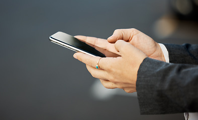 Image showing Phone, hands and woman texting in a city street for travel, location and internet, search or tracking closeup. Hand holding, smartphone and female checking social media, app or email on town commute