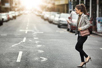 Image showing Phone, walking and business woman in city for social media, email and mockup space at sunset commute. Mobile, consultant and professional in street on smartphone for networking, travel and lens flare