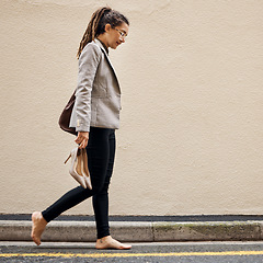 Image showing Tired, depression and business woman in city for thinking, fatigue and fear. Burnout, mental health and mistake with female employee walking in street for sad, failure and crisis with wall mockup