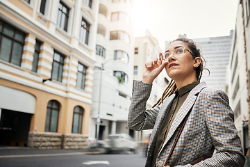 Image showing Corporate woman in city, travel and commute to work with buildings, motion blur and waiting for taxi cab. Professional female person in urban street, business clothes and journey to workplace