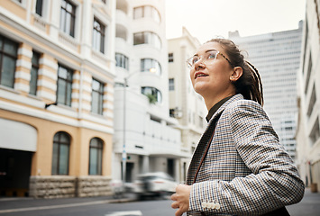 Image showing Professional woman in city, travel and commute to work with buildings, motion blur and waiting for taxi cab. Corporate female person in urban street, business clothes and journey to workplace