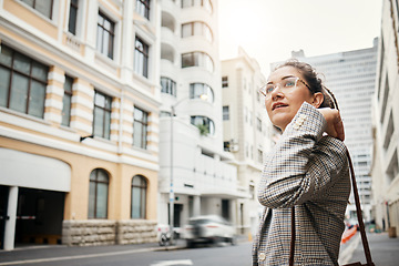 Image showing Business woman in city, travel and commute to work with buildings, motion blur and waiting for taxi cab. Corporate female person in urban street, professional clothes and journey to workplace