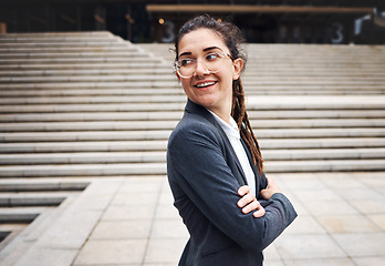 Image showing Crossed arms, city and business woman on stairs with happy mindset for morning commute, journey and travel. Professional, happy and female person with smile for career, work and job in urban town