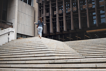 Image showing Walking, city and business woman on steps for morning commute, journey and travel. Professional goals, growth and female person with coffee for career, work and job progress in urban town by building