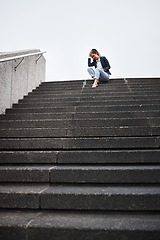 Image showing Depression, stairs and business with woman in city for unemployment, job loss and sad. Problem, stress and fear with female employee thinking in outdoors for mental health, frustrated and failure