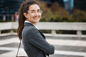 Image showing Business, city and portrait of woman with crossed arms on morning commute, journey and travel. Professional growth, corporate worker and female person for career, work and future job in urban town