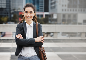 Image showing Business woman, smile portrait and arms crossed outdoor, happy from job pride as a worker. City, entrepreneur and work commute travel with professional and female person from New York in urban town