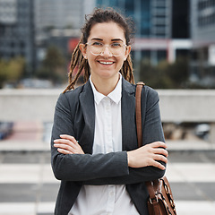 Image showing Business, crossed arms and portrait of woman in city on morning commute, journey and travel. Professional, corporate worker and happy female person for career progress, work and future in urban town