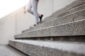 Image showing Stairs, legs and city person leaving, walking or on urban journey, urban commute or trip to destination. Outdoor blur concrete cement steps and professional person departure on building staircase