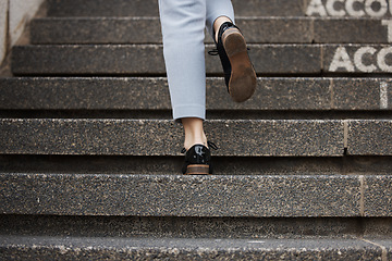 Image showing Closeup, shoes and person walking up stairs, travel and fancy with formal outfit, career and professional. Zoom, walk and employee with clothes, city and outdoor with stylish footwear and trendy