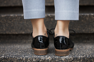 Image showing Stairs, city person and leather shoes waiting, travel or on morning journey, outdoor commute or urban trip. Company steps, ground floor and closeup legs, feet or business agent climbing staircase