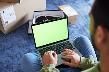 Image showing Online shopping, man with laptop, green screen and boxes on floor, shoes and delivery service on digital app. Sale, discount and ecommerce on fashion retail brand website, internet search on computer